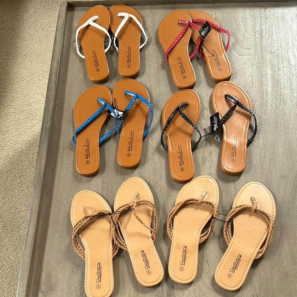 White line and discovery sandles all new and size 9 any questions ask